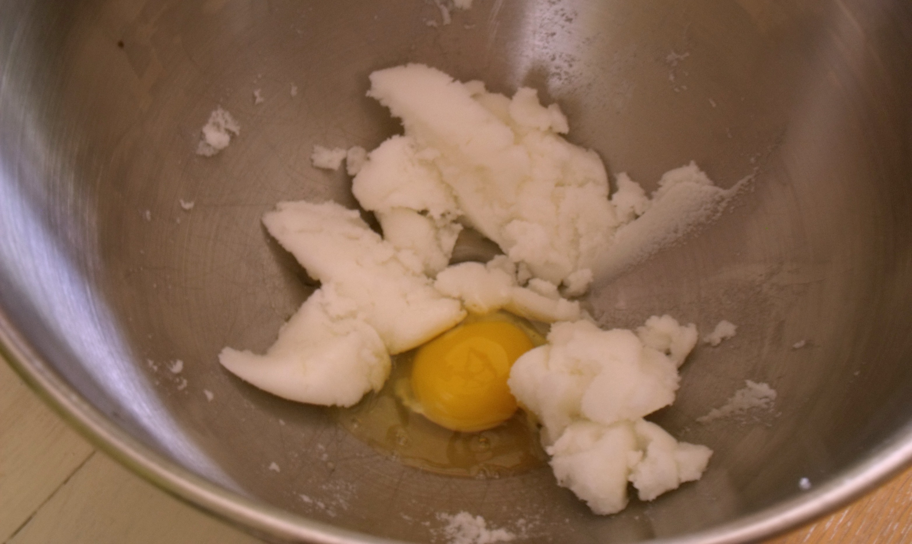 Adding egg to sugar